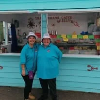 The Little Blue Hut team outside the hut