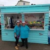 The Little Blue Hut team at the serving window