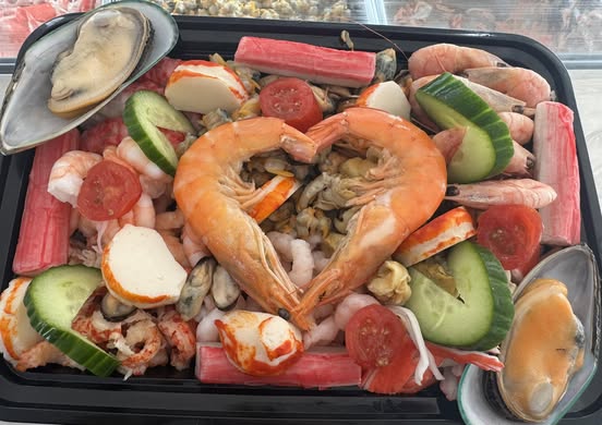Seafood platter with prawns, shellfish and salad