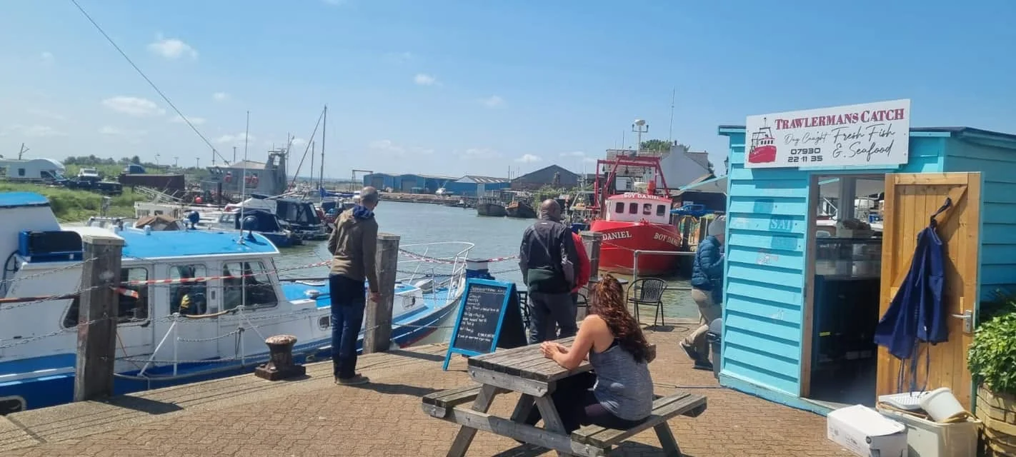 Working boats and The Little Blue Hut beside Queenborough Harbour