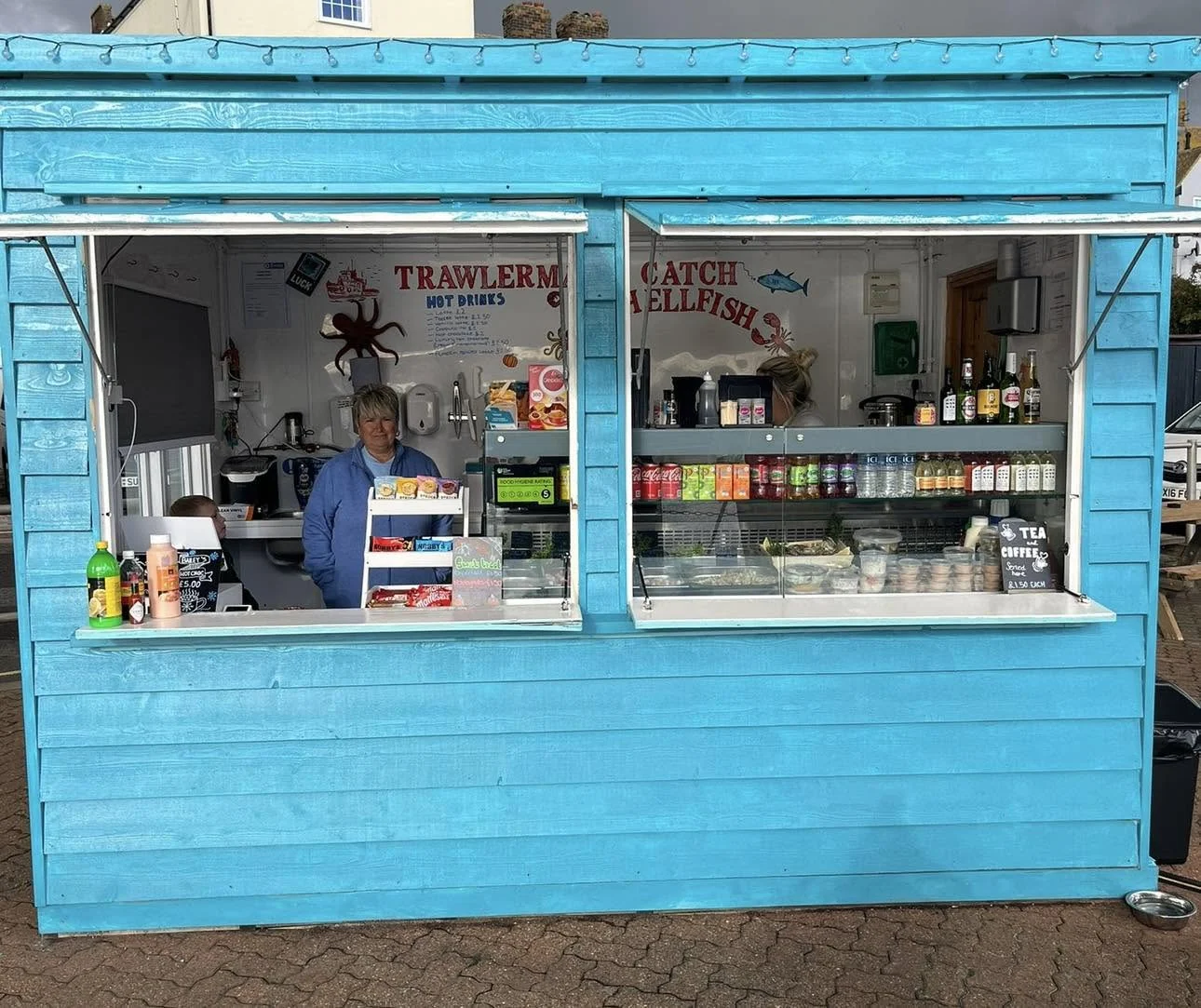 The team serving at The Little Blue Hut window